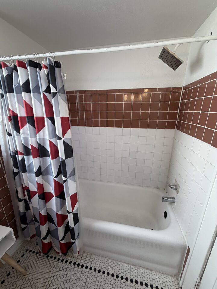 Bathroom with a full tub and shower