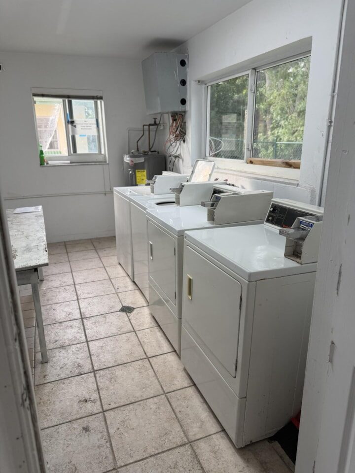 On-site laundry room with washers and dryers