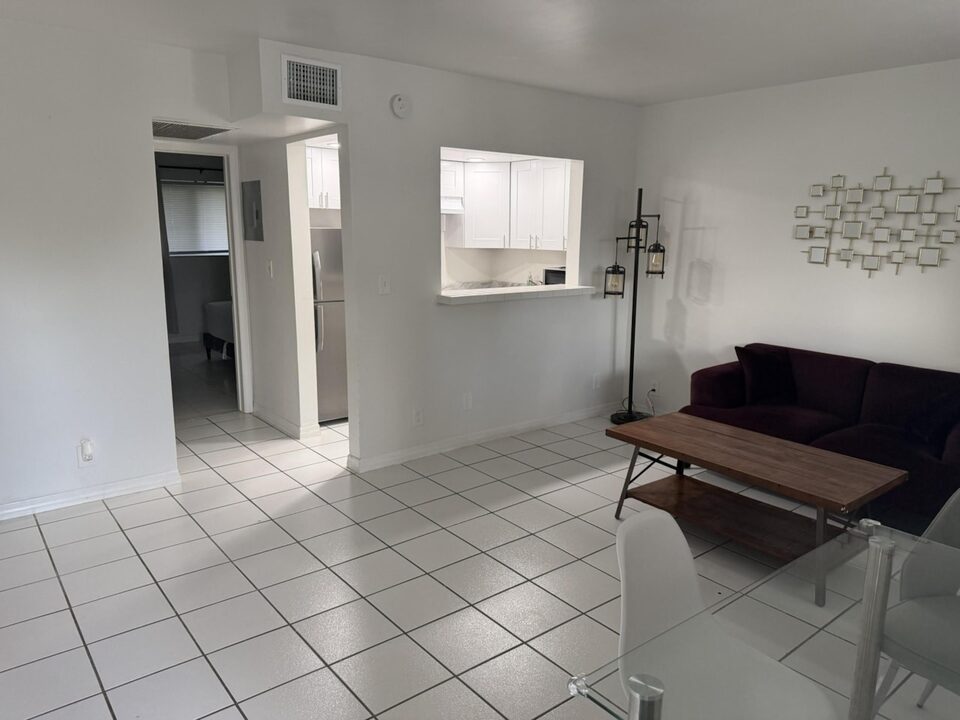 Living area with tile floors, sofa and side table