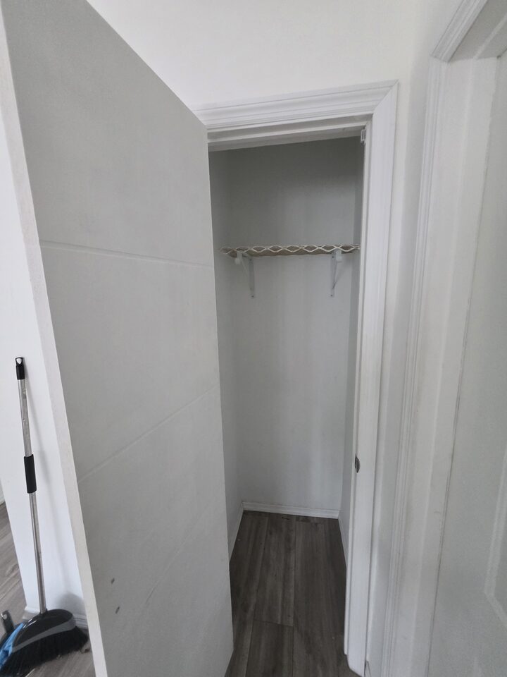 Closet with a hanging rail and a shelf