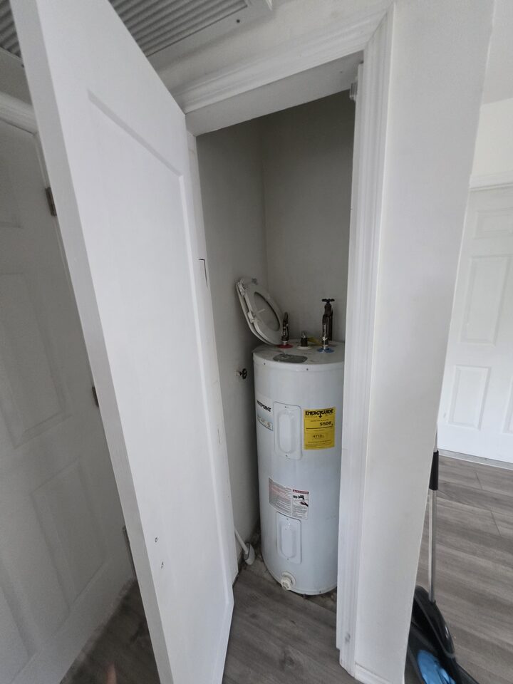 Utility closet housing the water heater