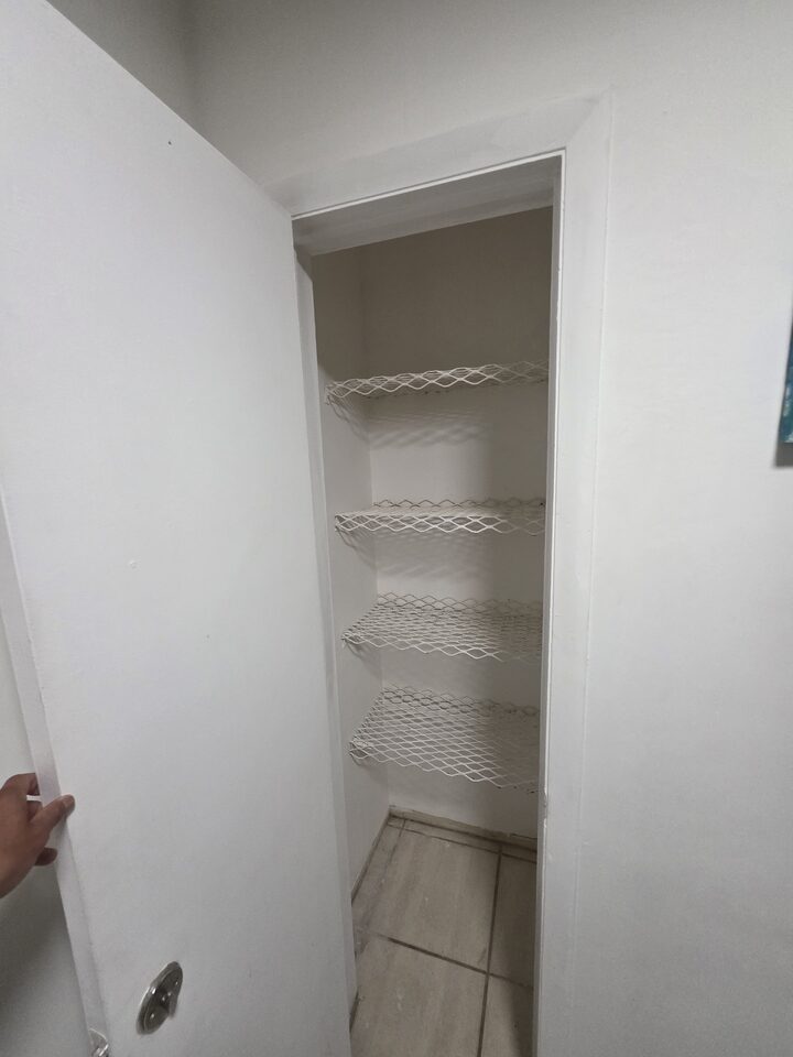 Linen closet with four wire shelves