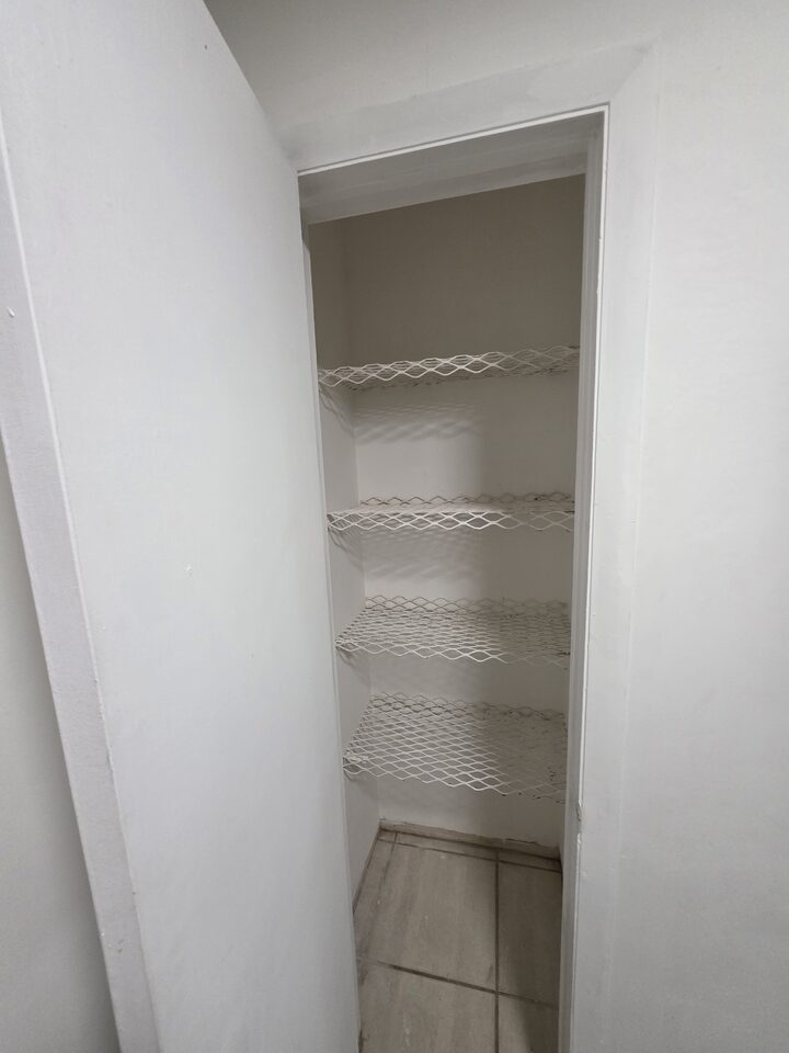 Linen closet with wire shelving