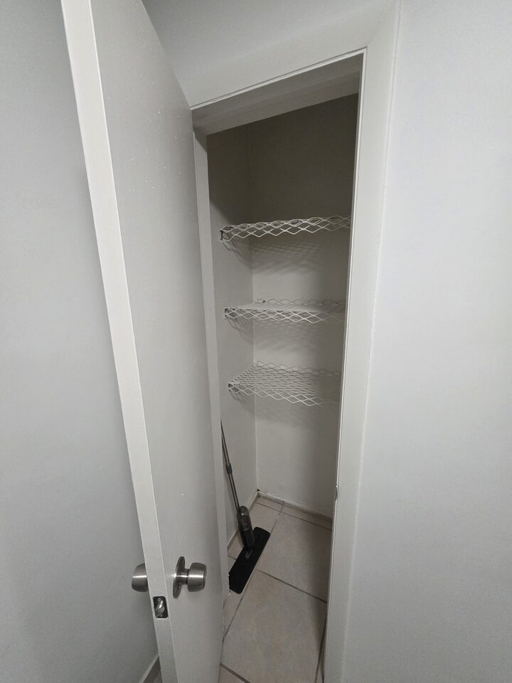 Linen closet with three wire shelves
