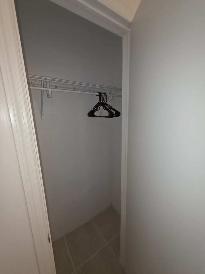 Closet with a hanging rail and hangers
