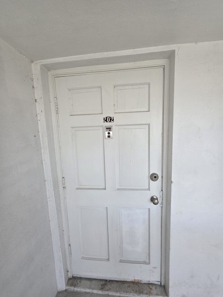 Front door of apartment 202
