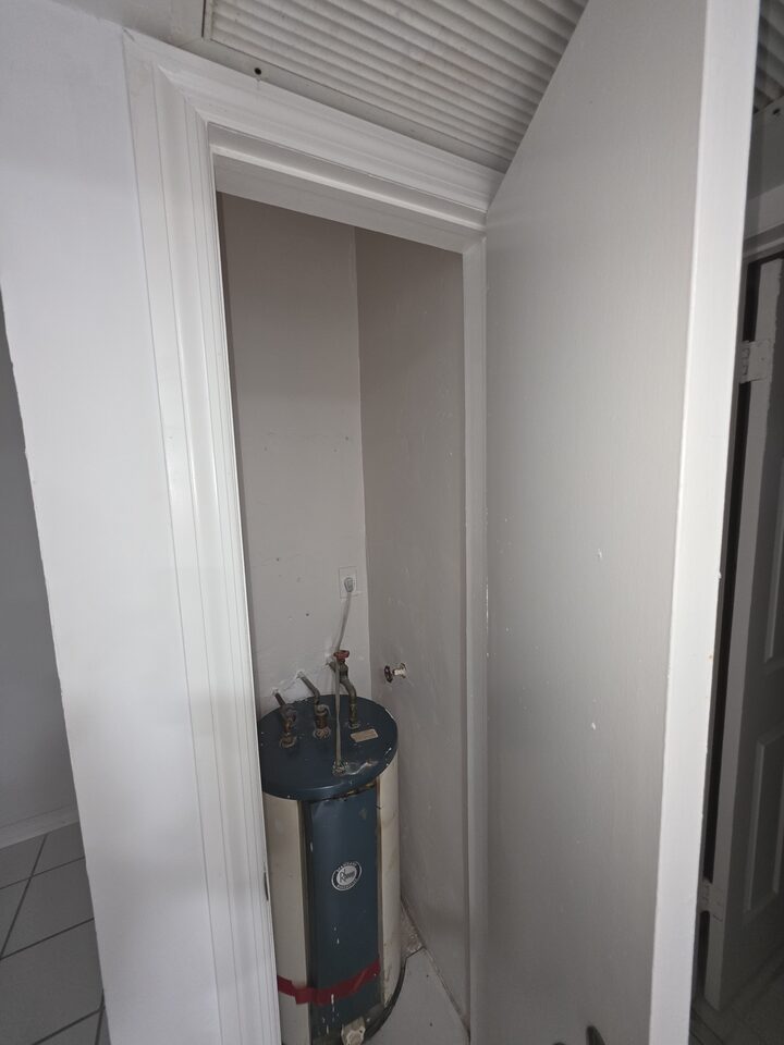 Utility closet housing the water heater