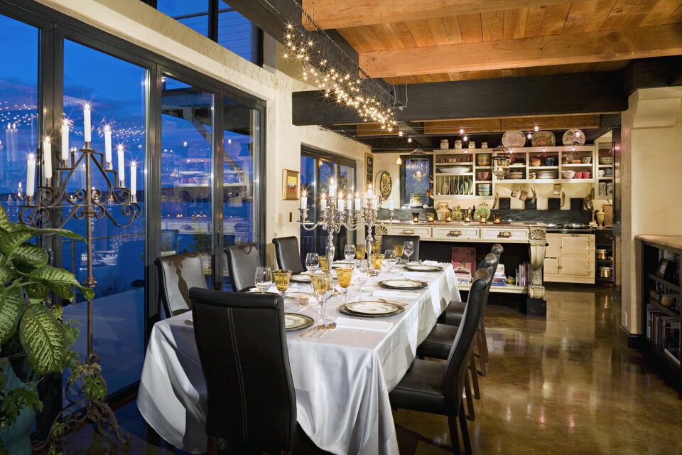 A dining room laid for dinner in the evening