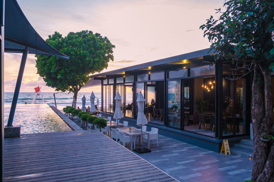 A modern infinity pool looking out over the beach